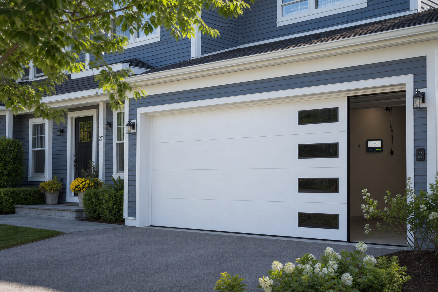 Framingham home exterior with a visible garage door and smart opener setup